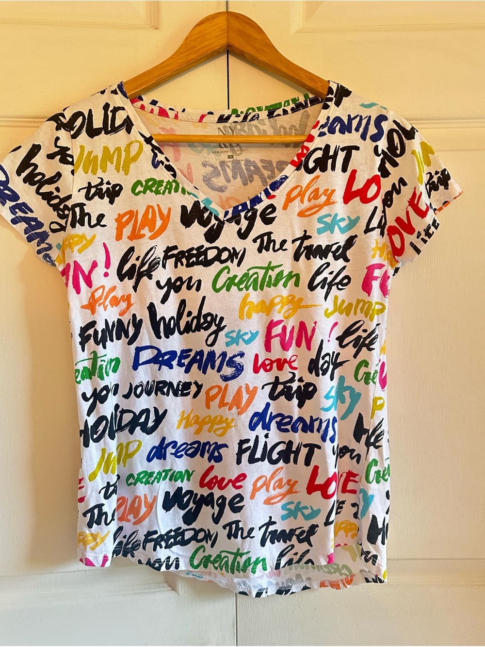 New York & Company White V-Neck Tee with Multicolor Script